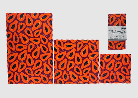 Set of three Meli Wraps beeswax food wraps in purple papaya print, including small, medium, and large sizes for food storage.