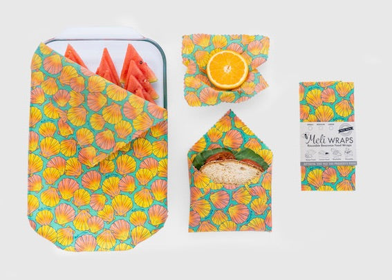 Set of Meli Wraps beeswax food wraps in sunrise shell print, including small, medium, and large sizes for food storage.