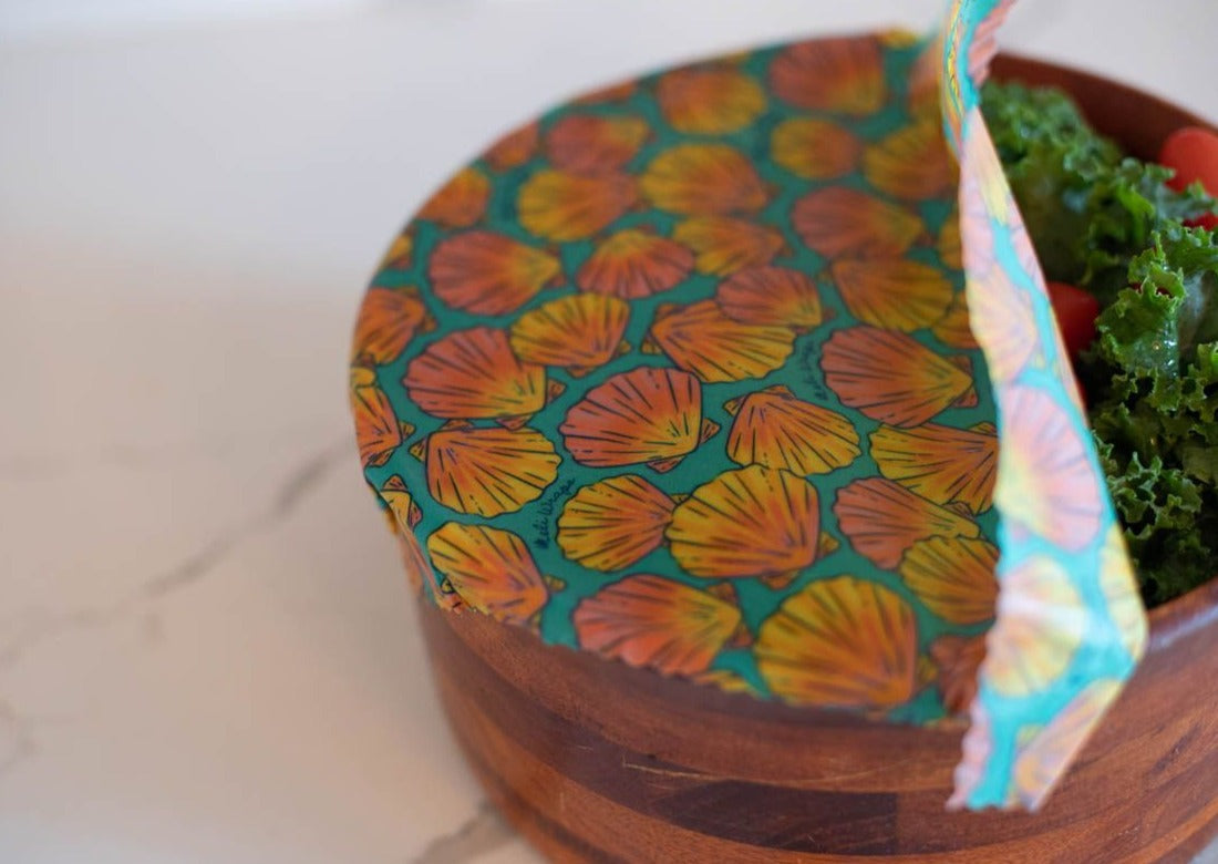 Set of Meli Wraps beeswax food wraps in sunrise shell print, includes small, medium, and large wraps for food storage.