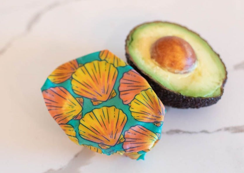 Set of Meli Wraps beeswax food wraps with sunrise shell print in small, medium, and large sizes for food storage.