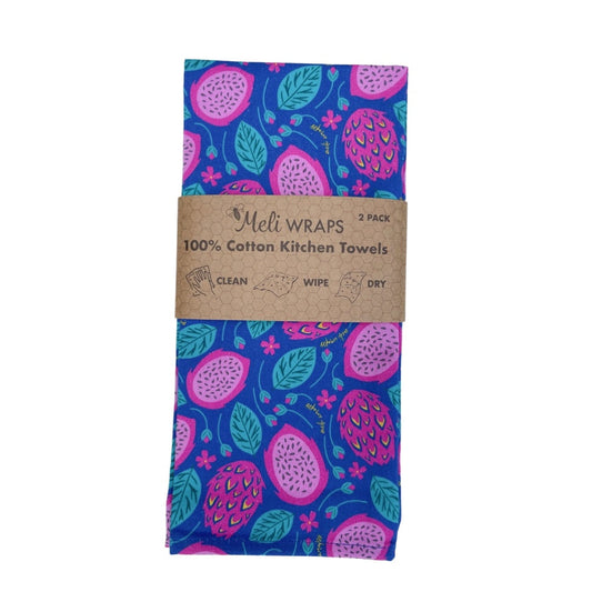 A vibrant two-piece kitchen towel set from Meli Wraps’ Beeswax Eco-Friendly Dragonfruit Gift Set—features folded cotton towels with pink and green fruit on blue, ideal for eco-conscious kitchens.