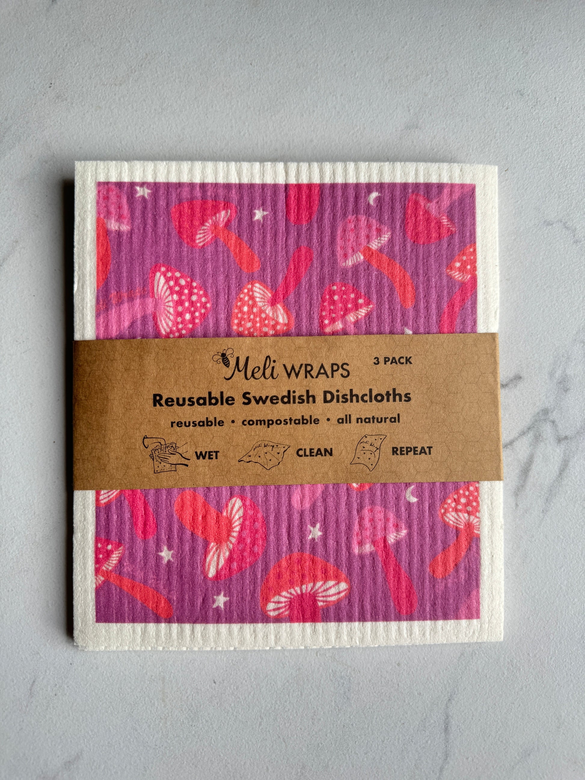 Set of three purple mushroom Swedish dish cloths by Meli Wraps, eco-friendly kitchen cleaning cloths with mushroom pattern.