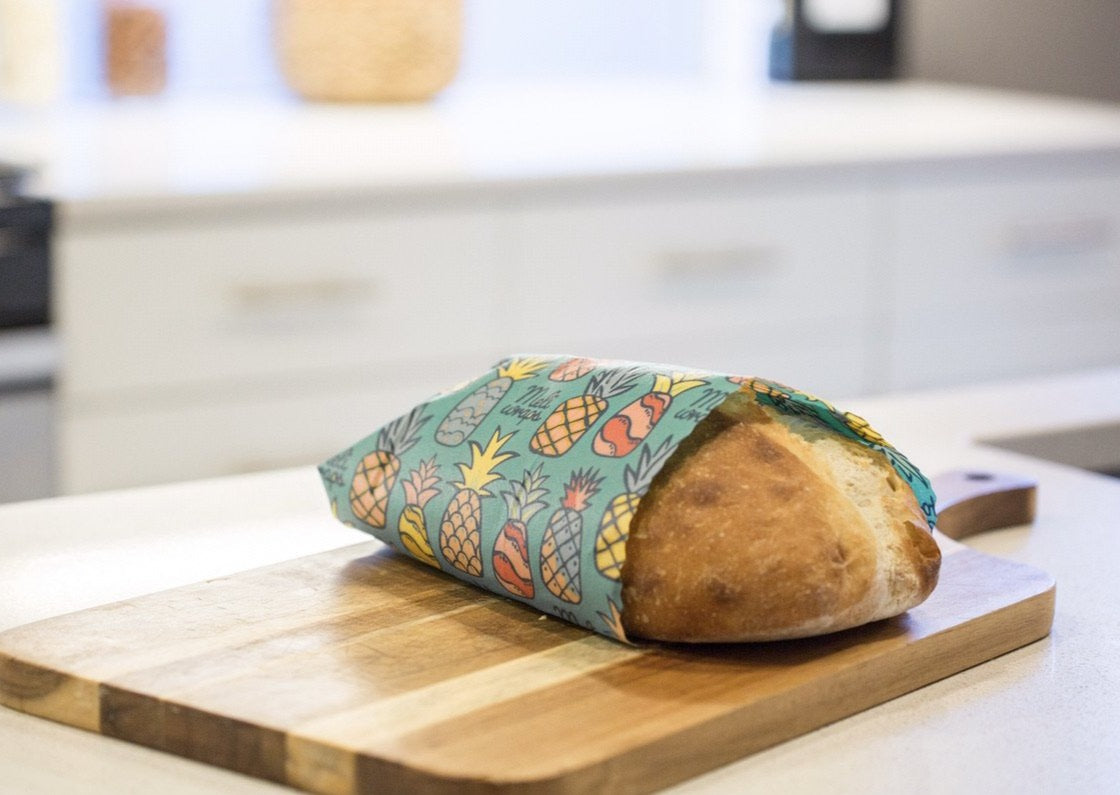 Set of three Meli Wraps beeswax wraps in Hawaiiana print, including small, medium, and large sizes for food storage.