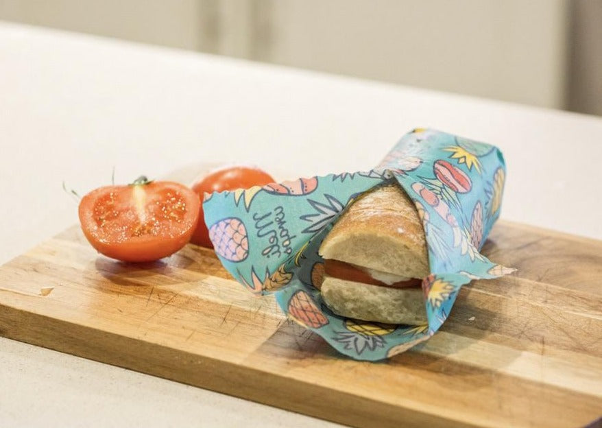 Set of three Meli Wraps beeswax wraps in Hawaiiana print, including small, medium, and large sizes for food storage.