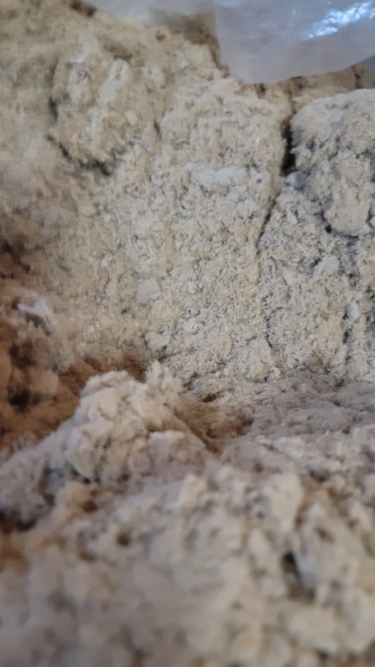Close-up of Worm Bedding EcoFluff by Memes Worms—a rough, beige, powdery, and crumbly material—ideal for sustainable vermiculture and filling the frame.