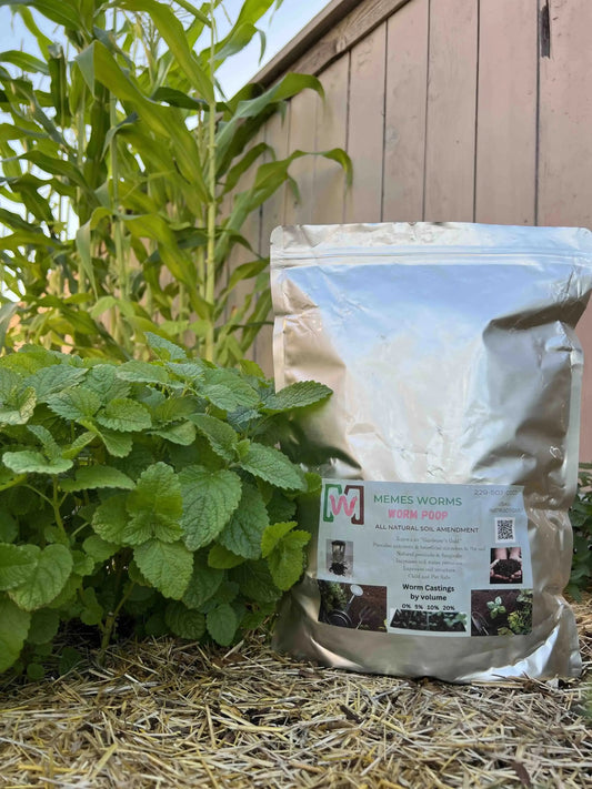 Organic fertilizer worm castings by Meme's Worms in a 1-gallon container, ideal for nourishing plants and promoting healthy growth.