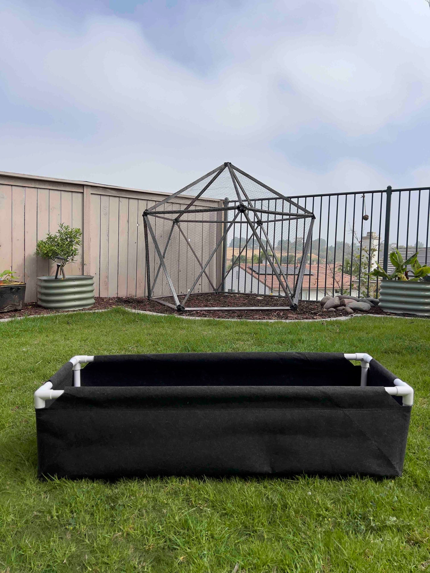 Fabric raised worm farm worm bin by Meme's Worms with breathable fabric sides and a compact, elevated design for worm composting.
