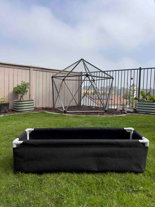 Fabric raised worm farm worm bin by Meme's Worms with breathable fabric sides and a compact, elevated design for worm composting.