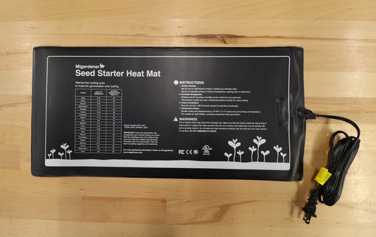 MIgardener Premium Seed Starting Heat Mat laid flat, designed to provide warmth for seedlings in gardening setups.