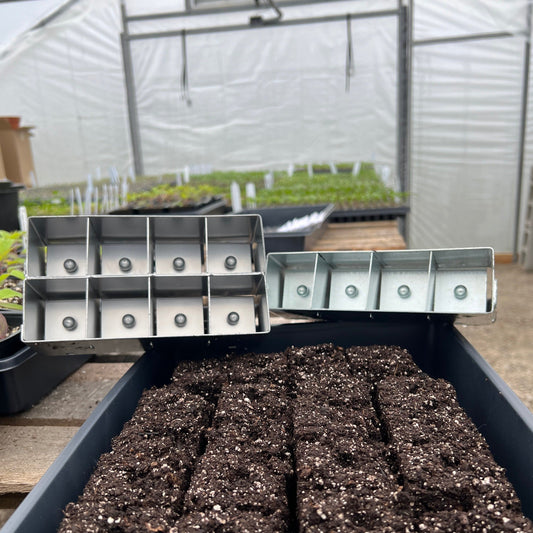 MIgardener Soil Blocker for home and garden, shown with four soil blocks ready for planting. Durable gardening tool.