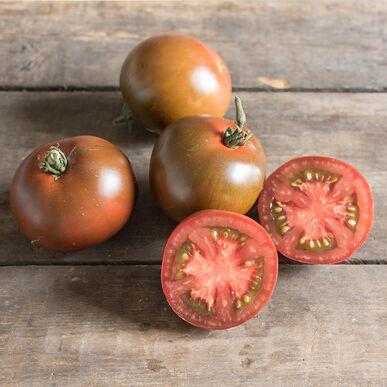 Black Prince Tomato from MIgardener, ripe, dark purple-black heirloom tomato with glossy skin and vibrant interior.