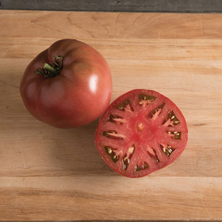Fresh MIgardener Carbon Tomato plant with vibrant green stems and lush leaves, ready for planting or harvest.