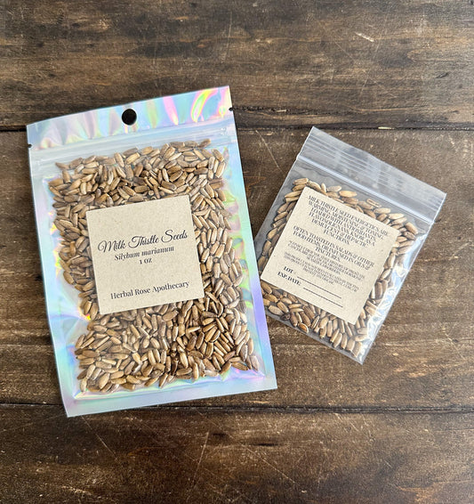 Dried milk thistle seeds labeled in a jar, herbal herbalroseapothecary dried herbs for herbal remedies and natural health.
