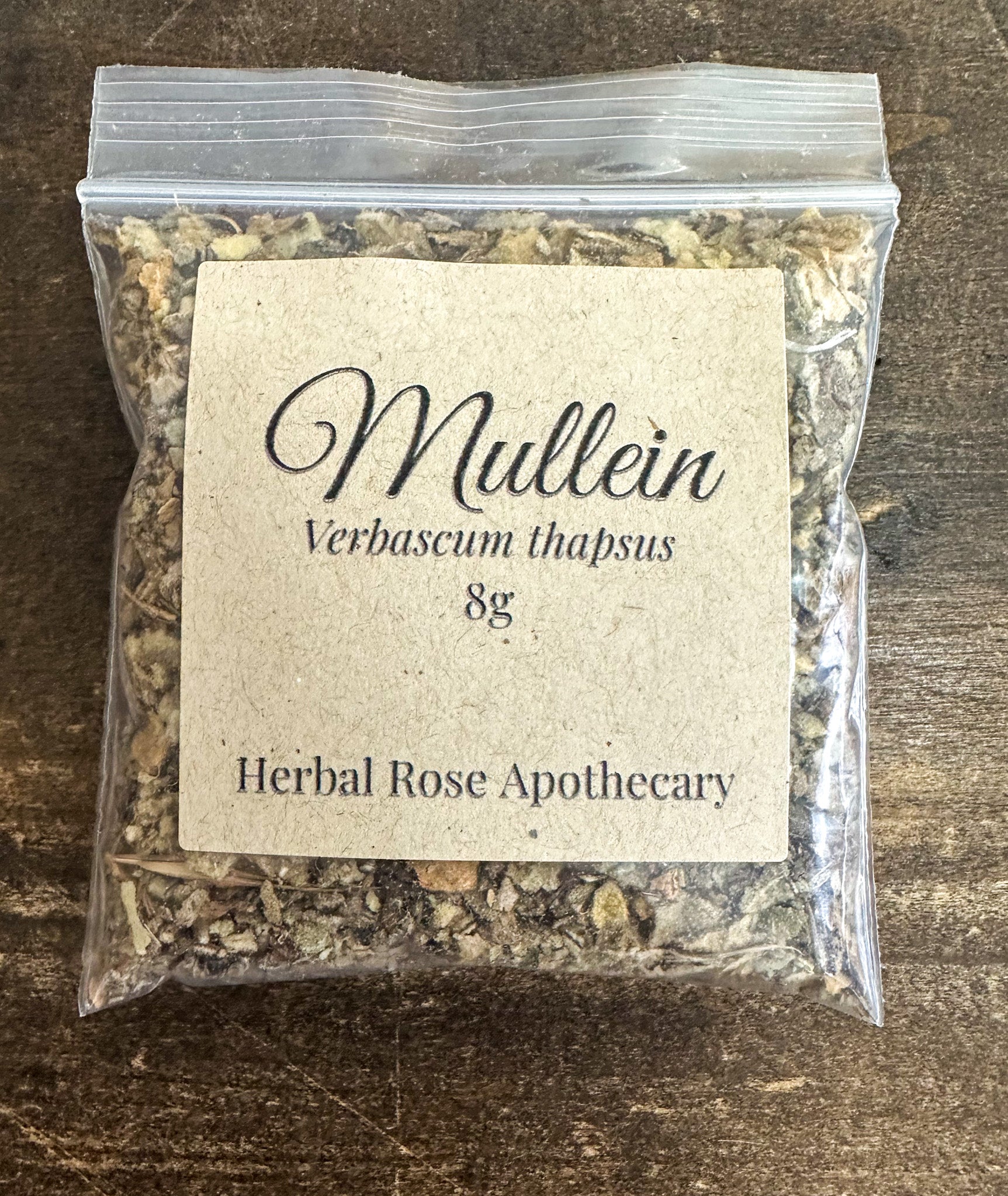 Dried mullein herb from herbalroseapothecary, 8g package, showing loose gray-green leaves and seed pods for herbal remedy use.