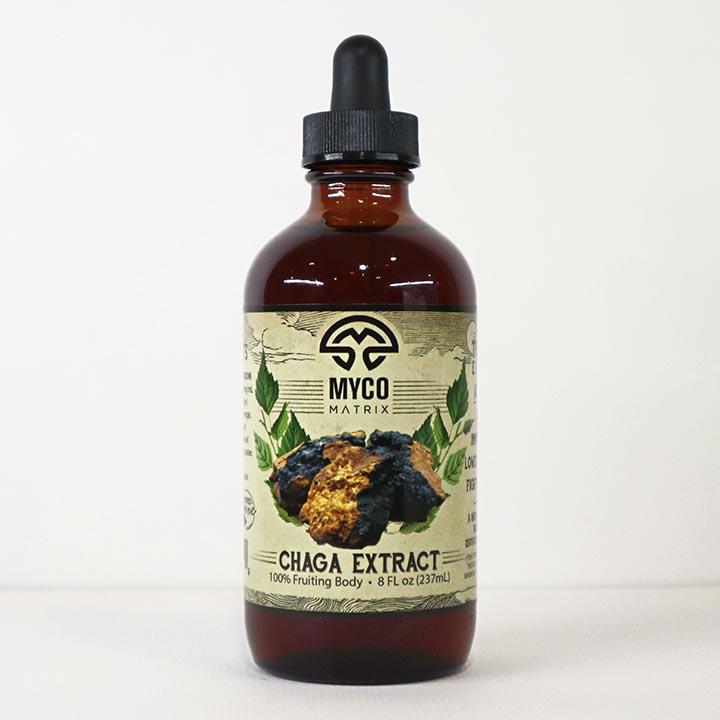 Mycomatrix CHAGA adaptogenic mushroom extract from Mushroom Mountain in a 2oz jar with fresh Chaga mushroom pieces.