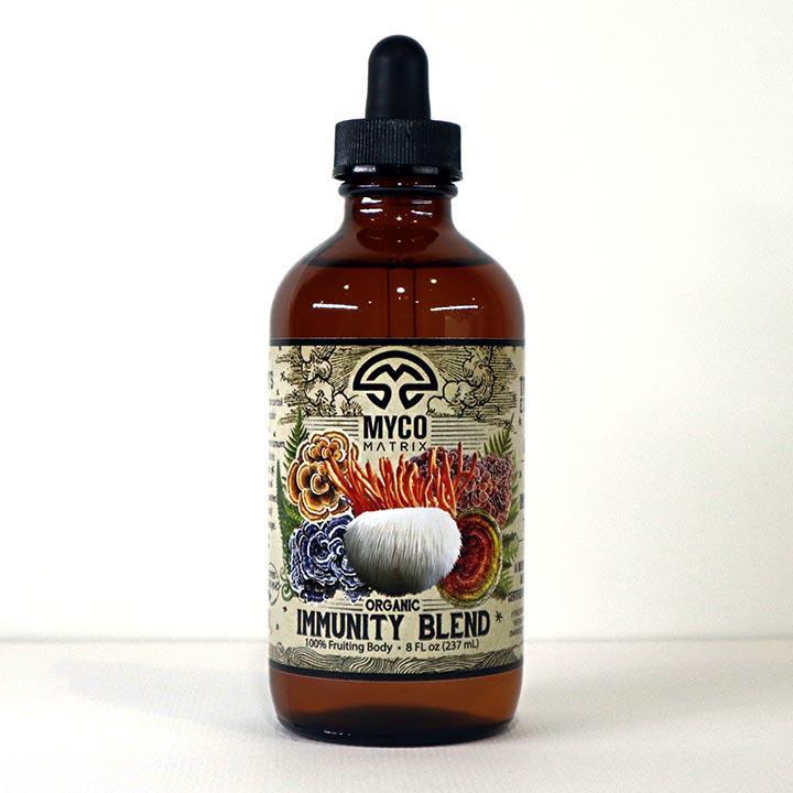 Mycomatrix Immunity Blend adaptogenic mushroom extract from Mushroom Mountain, in a 2oz jar with mushroom imagery.