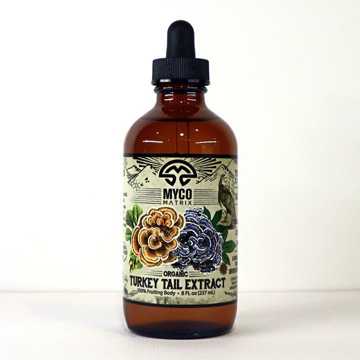 Mycomatrix Turkey Tail adaptogenic mushroom extract in a 2oz bottle by Mushroom Mountain, showing the product label and packaging.