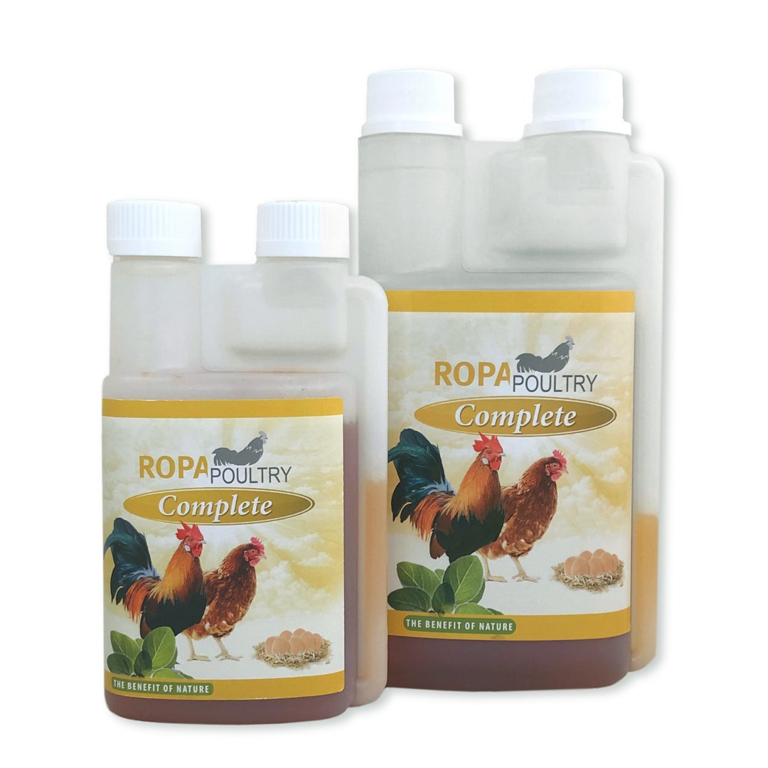 Bottle of RopaPoultry Oregano Oil+ supplement for chickens, showing the 250ml size option, in a farm setting with chickens nearby.