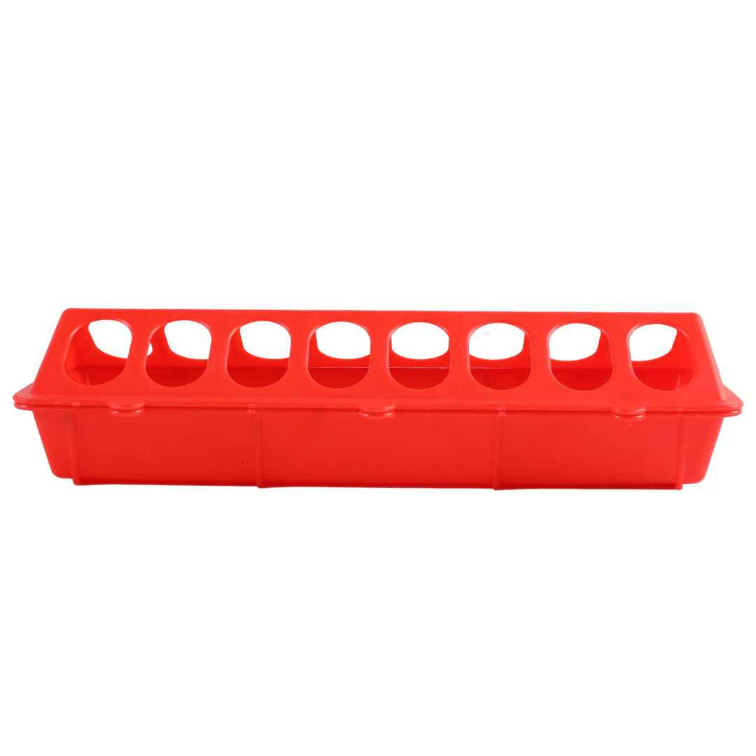 A red plastic ice cube tray with eight oval-shaped compartments resembles the My Pet Chicken Farmight 12 flip top feeder when viewed from the front.
