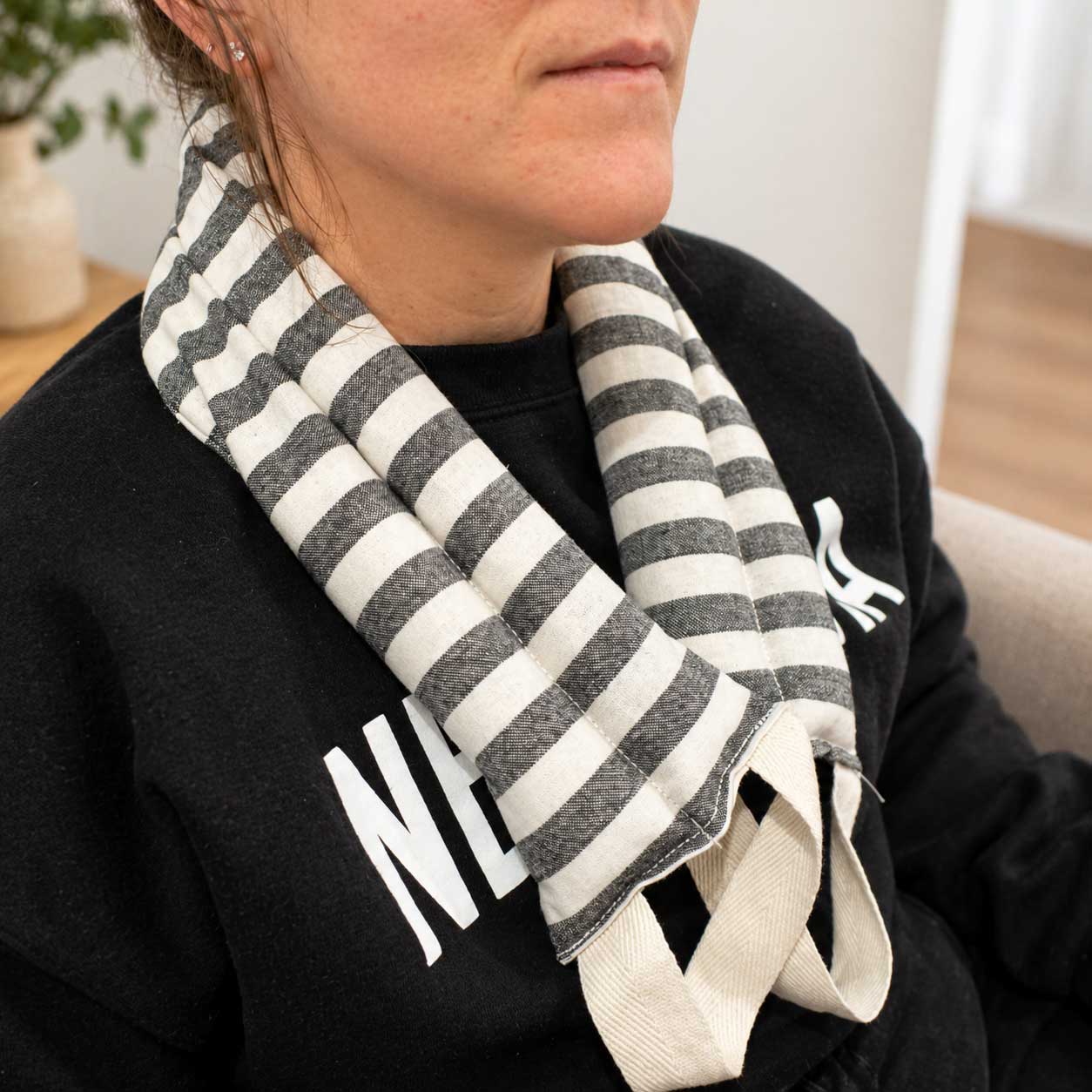 Lavender neck wrap heating pad by Our Lavender Co, 28"x4" fabric, designed for soothing neck and shoulder relaxation.