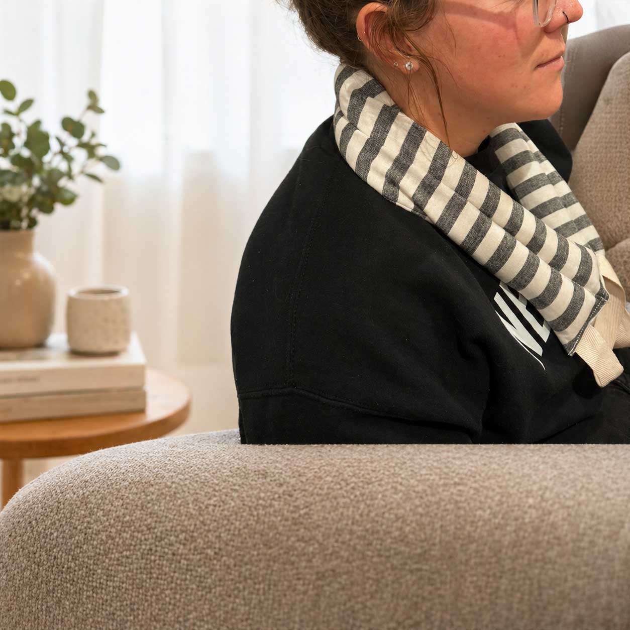 Lavender neck wrap heating pad from Our Lavender Co, 28x4 inches, made of soft fabric, designed for soothing neck relief.