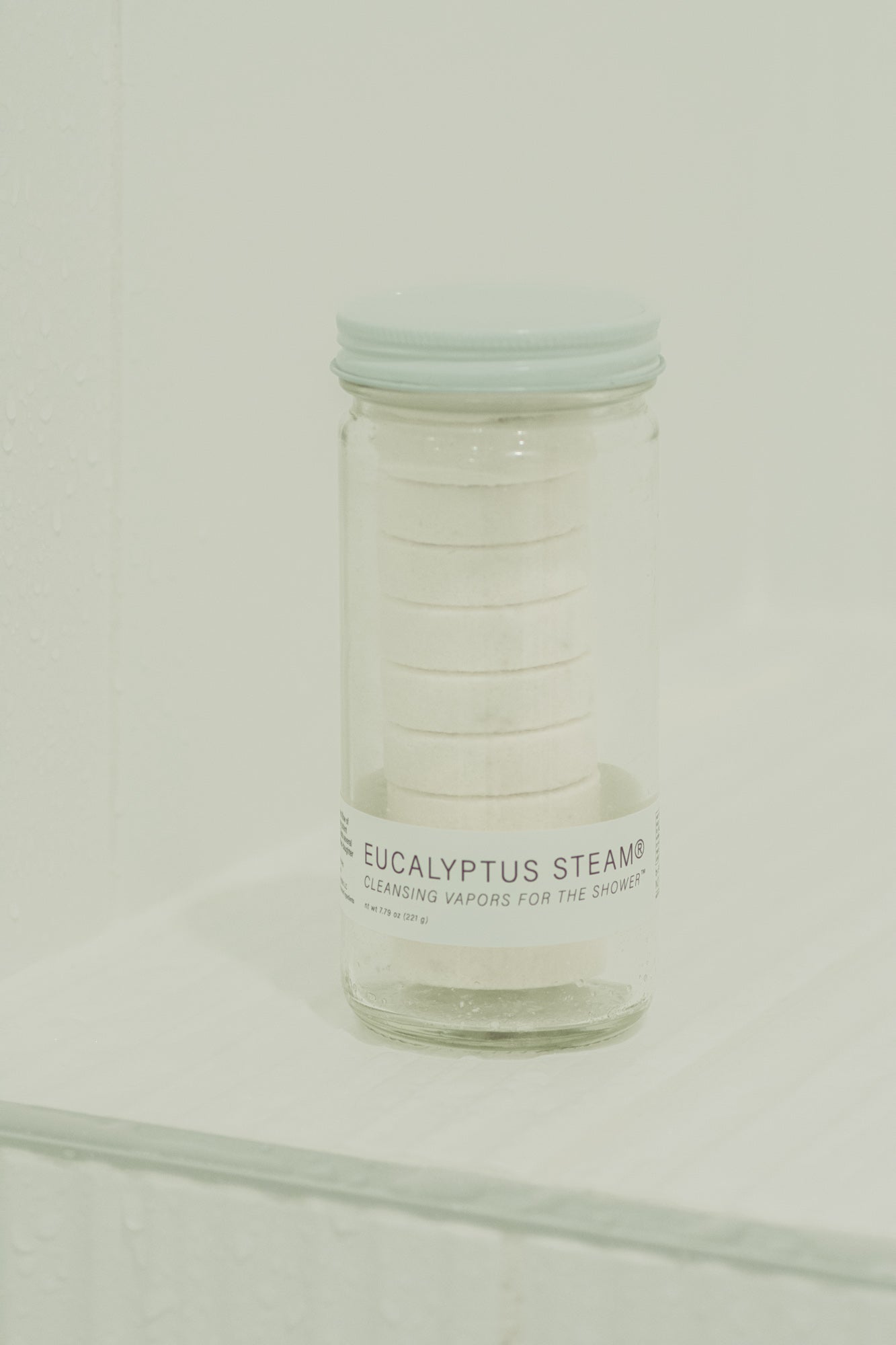 Eucalyptus Steam cleansing vapors for shower in a normal jar by NO TOX LIFE, with fresh eucalyptus leaves and steaming vapor.