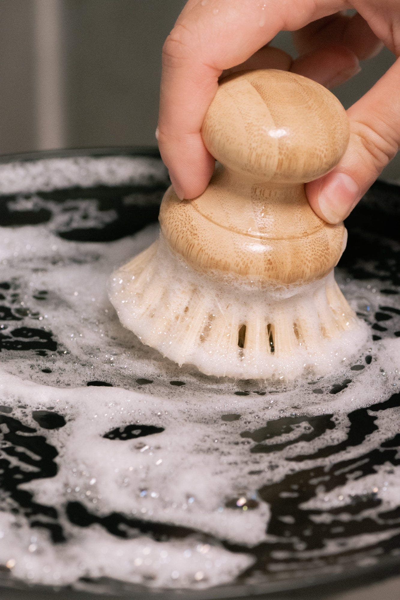 Solid dish soap bar by No Tox Life, 6 oz (170g), in a natural home and kitchen setting, showcasing the eco-friendly dish cleaning product.