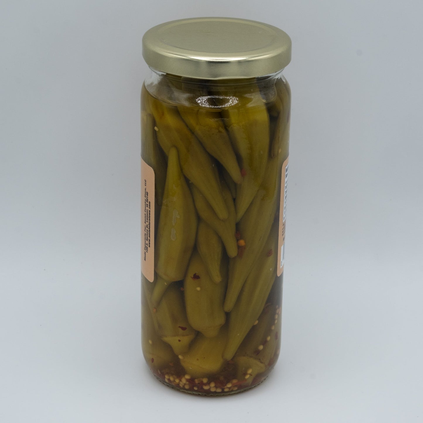 Jar of Amish Country Store pickled hot okra in a 16oz jar, showing vibrant green okra spears soaked in spicy brine.