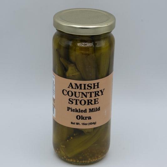 Jar of Amish Country Store pickled mild okra in a 16oz glass jar, showing green okra spears submerged in pickling brine.