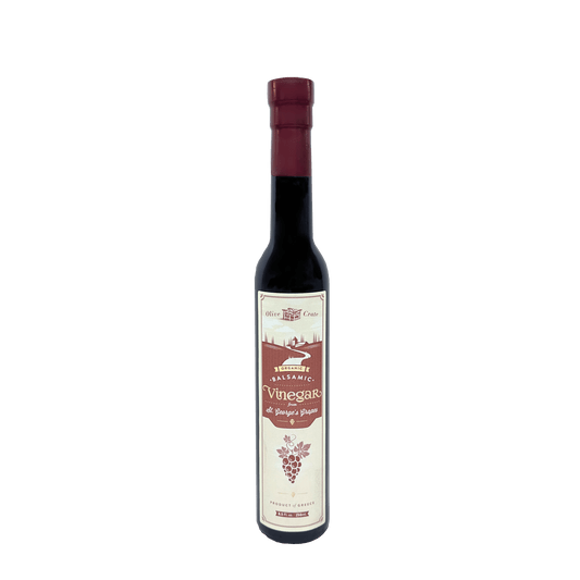 Organic balsamic vinegar from St. George's grapes by Olive Crate, featuring a dark, rich liquid in a glass bottle.