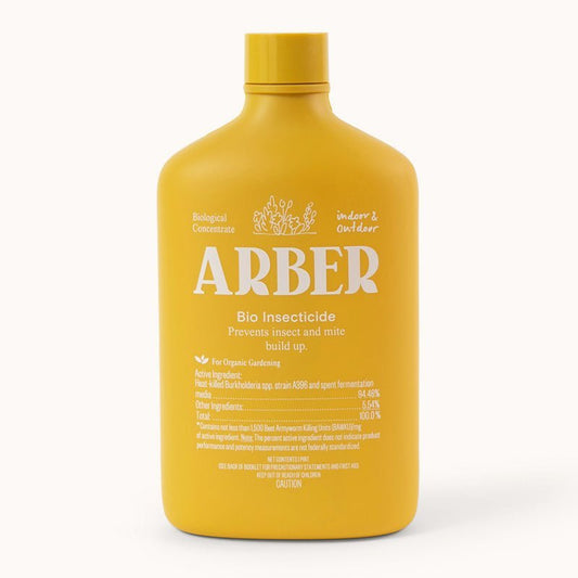 A yellow bottle labeled Arber Organic Bio Insecticide features white text and is designed for natural pest control in indoor and outdoor organic gardening. It combats soil-dwelling pests and includes detailed usage and ingredient information.