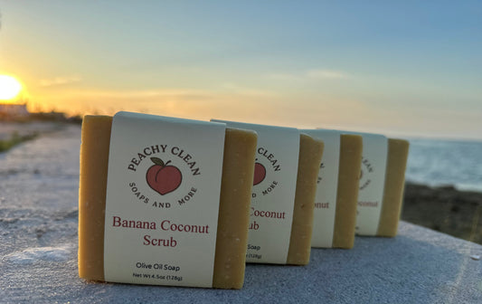 Banana Coconut Scrub by Peachy Clean Soaps and More LLC showing a jar of exfoliating body scrub with banana and coconut ingredients