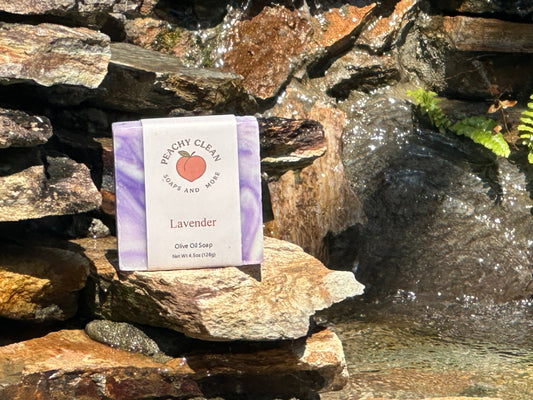 Lavender soap by Peachy Clean Soaps and More LLC with a bar of soap featuring lavender scent and floral design.