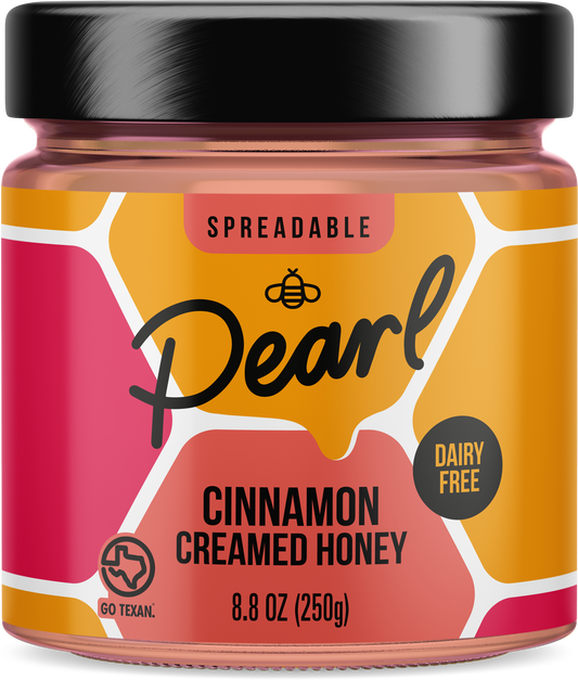 Creamed cinnamon honey from Pearl Honey Spreads, showing a jar with smooth honey and cinnamon swirl topping.