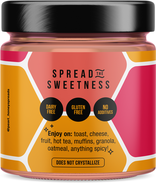 Creamed cinnamon honey from Pearl Honey Spreads, showing a jar of smooth, cinnamon-infused honey spread on a white background.