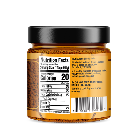 Jar of Pearl Honey Spreads bee pollen honey with a golden color, showcasing fresh bee pollen mixed into honey.