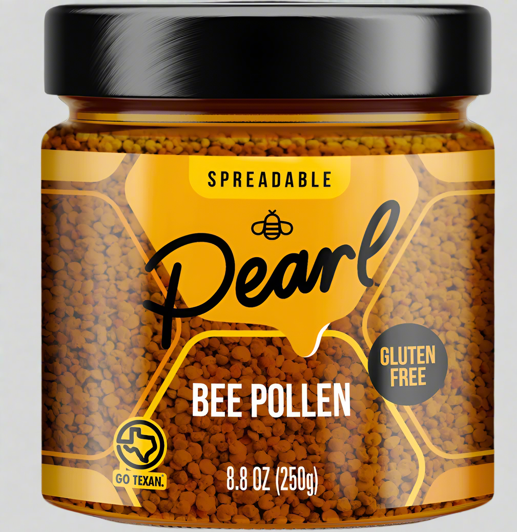 Jar of Pearl Honey Spreads bee pollen honey with a golden honey drizzle and fresh bee pollen topping on a white background.