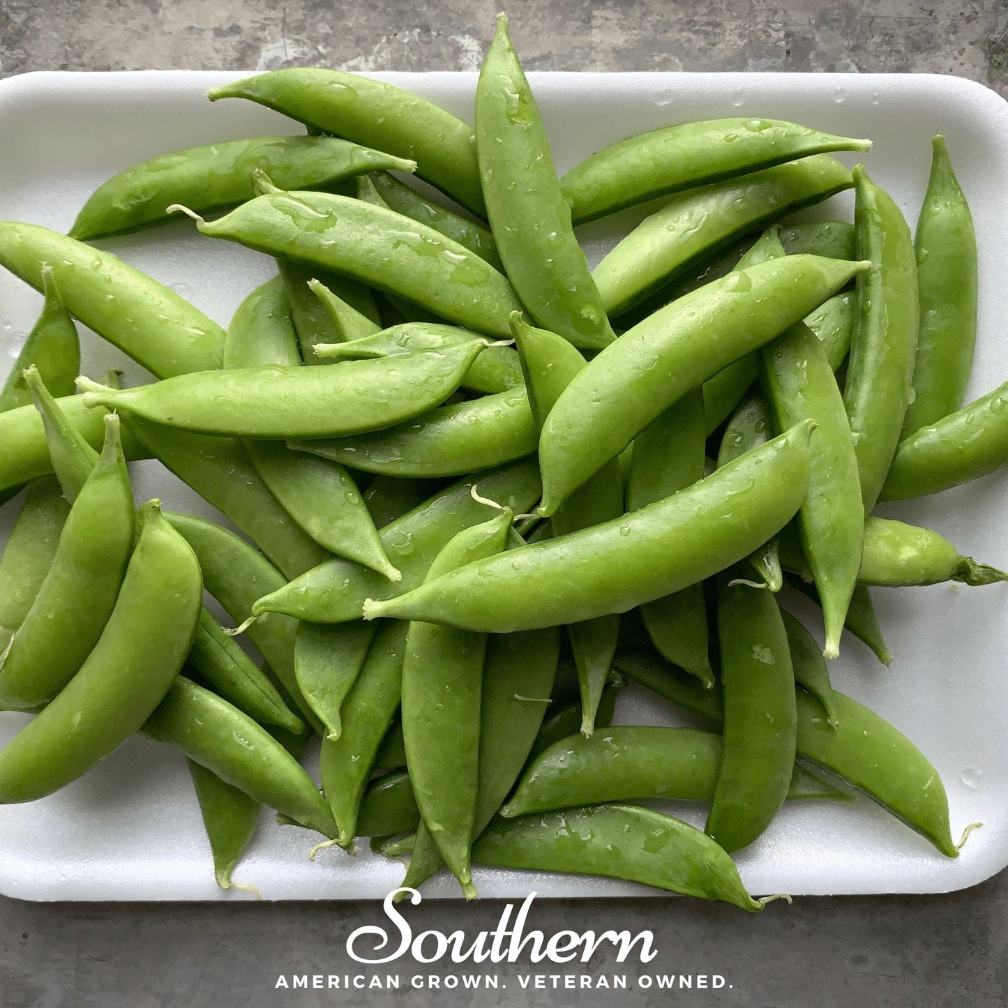Sugar snap peas seeds from Southern Seeds, showing green pea pods and seeds ready for planting.