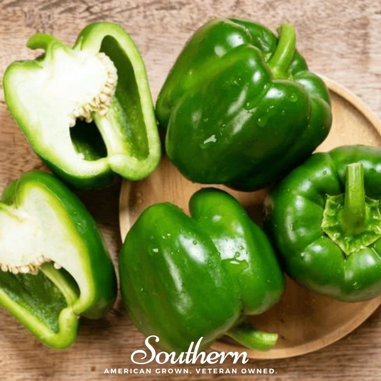 Cal Wonder sweet bell pepper seeds from Southern Seeds, showing vibrant green and red bell peppers on a plant.