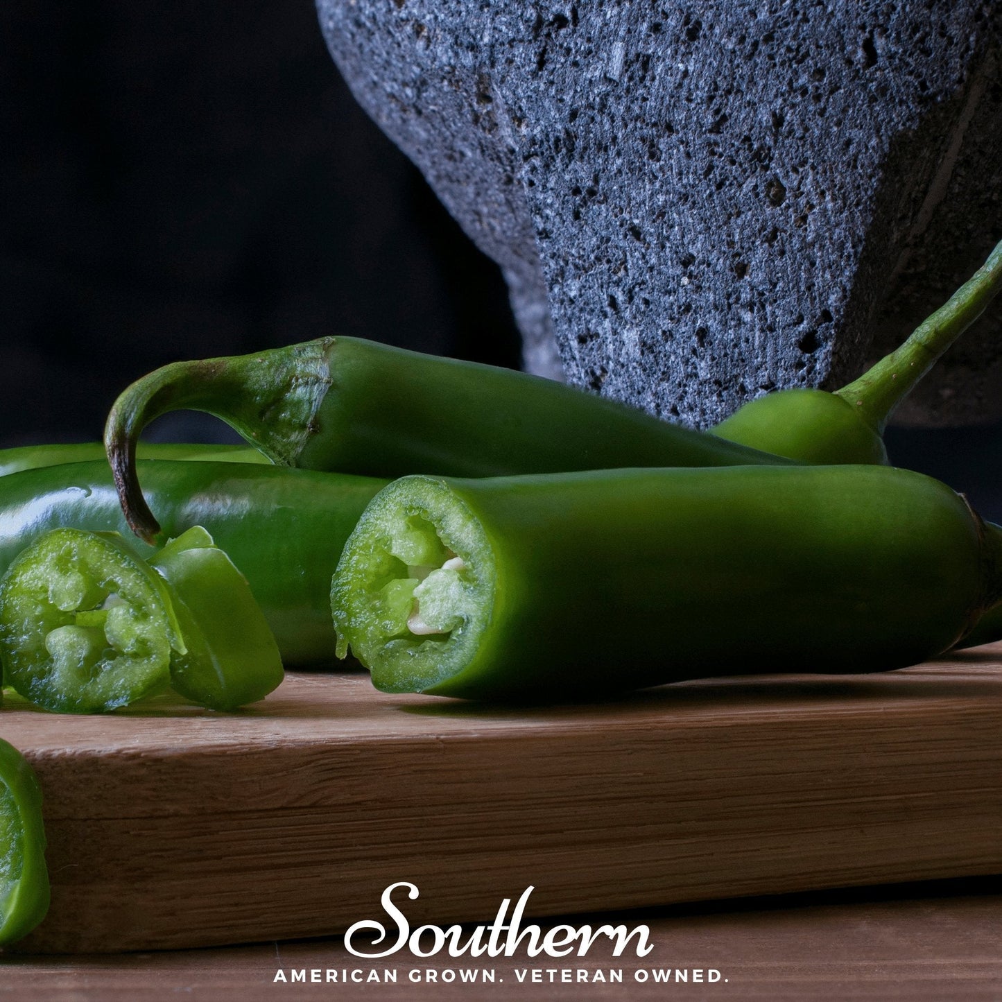 Pack of 25 Serrano Pepper seeds from Southern Seeds featuring vibrant green Serrano Capsicum annuum peppers.