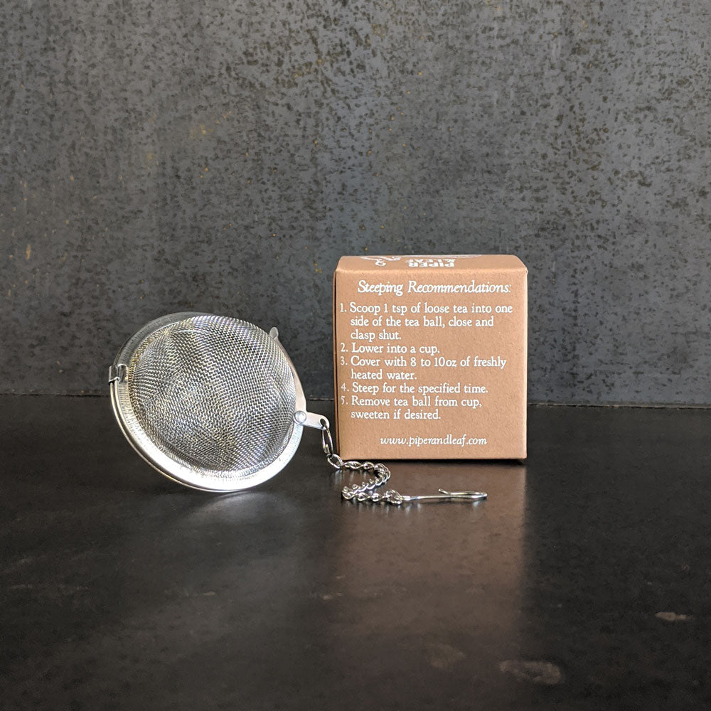 Piper Tea Ball brewing device by Piper and Leaf Tea Co. with stainless steel mesh for loose leaf tea infusion.