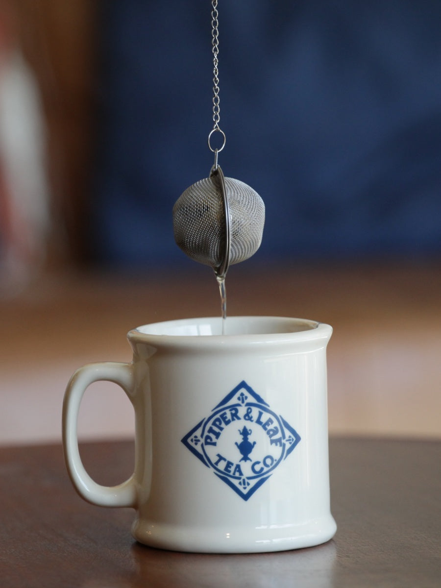 Piper Tea Ball brewing device from Piper and Leaf Tea Co., stainless steel tea infuser with mesh ball for loose leaf tea.
