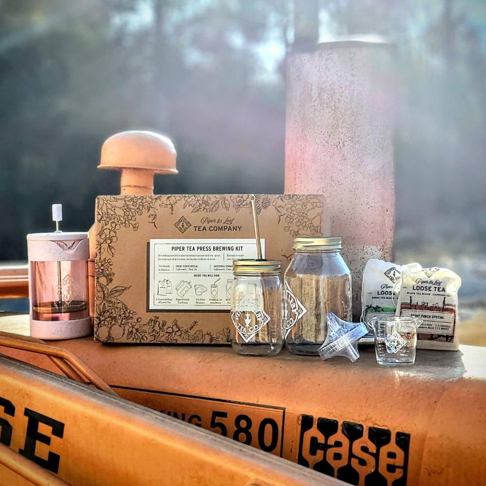 Piper and Leaf Tea Co. Piper Press Brew Kit for tea gifts, featuring a classic design on a front porch setting.