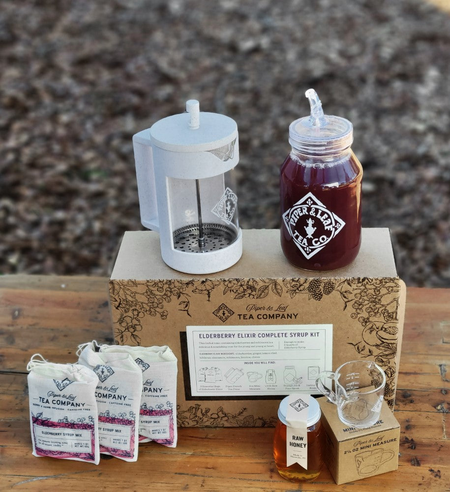 Elderberry Elixir Complete Syrup Kit gift set from Piper and Leaf Tea Co., featuring ingredients and tools for making elderberry syrup.