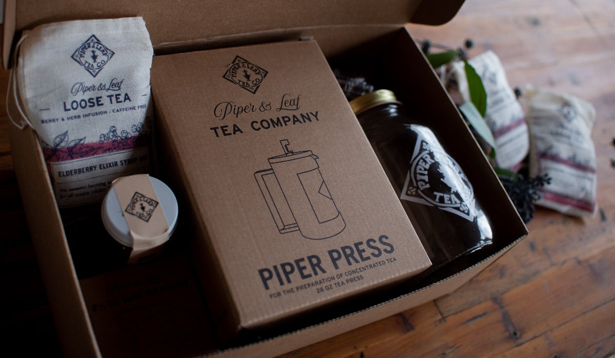 Elderberry Elixir Complete Syrup Kit by Piper and Leaf Tea Co., a gift set with ingredients and bottles for making elderberry syrup.