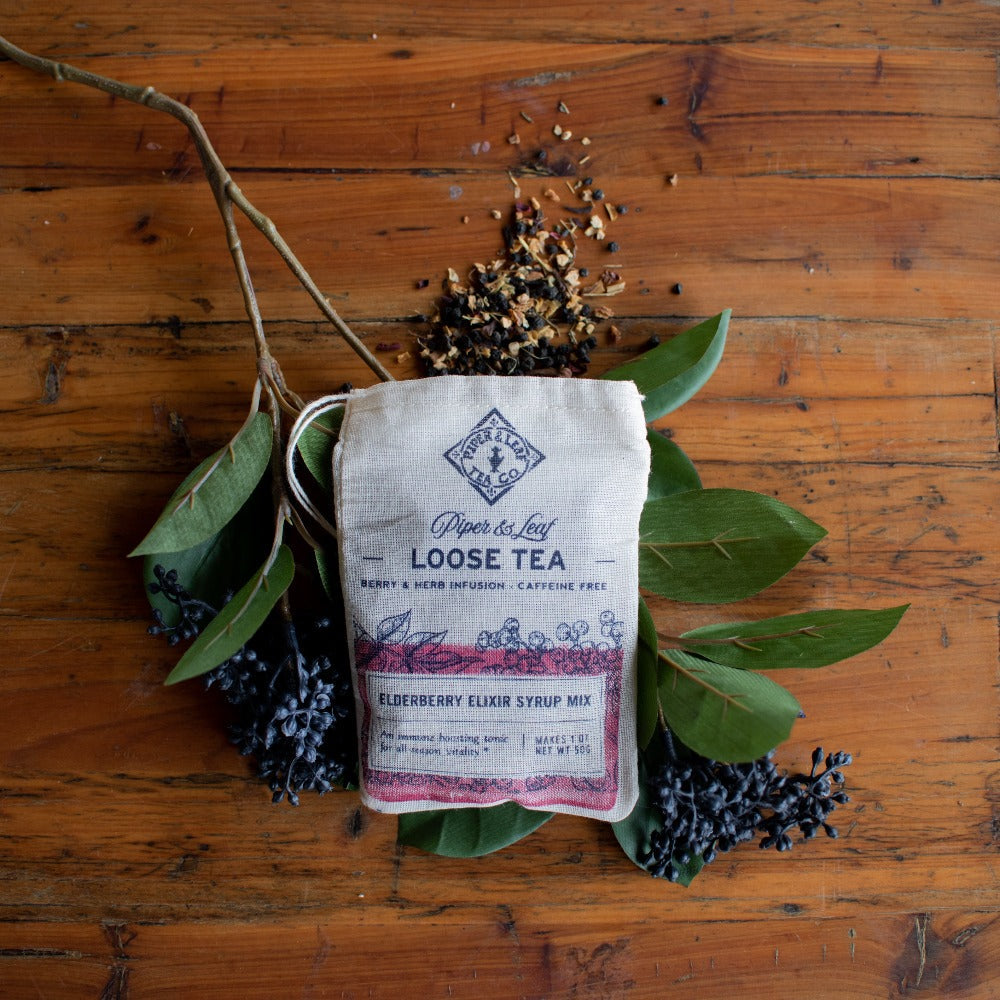 Elderberry Syrup Starter Brewing Kit by Piper and Leaf Tea Co. including bottles, ingredients, and brewing tools for homemade elderberry syrup.