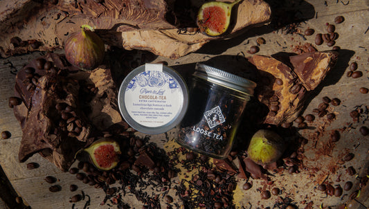Glass jar of Piper and Leaf Tea Co. Chocola-Tea loose leaf tea, showcasing dark tea leaves inside a clear container.
