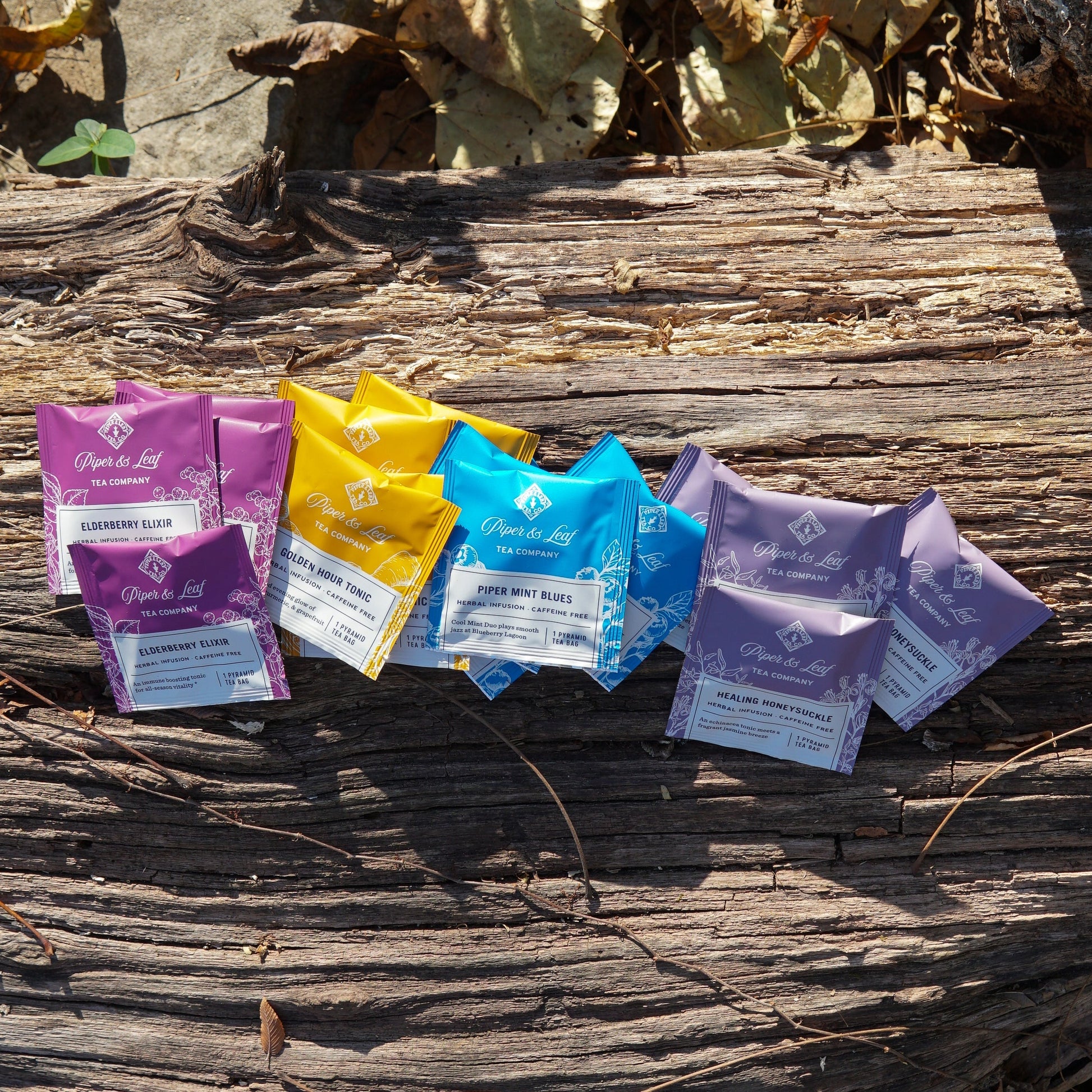 Assorted wellness tea sampler box with 16 tea bags from Piper and Leaf Tea Co., featuring herbal, green, and relaxing tea varieties.