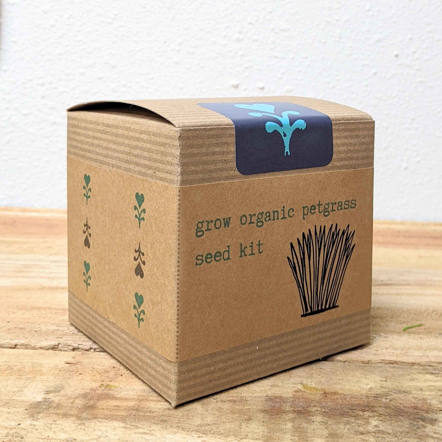 Organic Petgrass Grow Kit with sprouting seeds in a container, ideal for growing fresh petgrass at home.