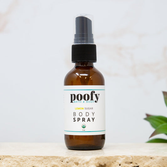 Poofy Organics Lemon Sugar Body Spray, organic body mist with fresh lemon and sweet sugar scent, in a clear spray bottle.